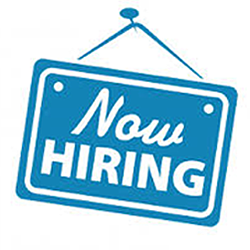 Hanging sign that reads 'Now Hiring'